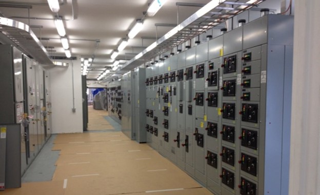 MCC interior — motor control center lineup with cable trays and conduit routing