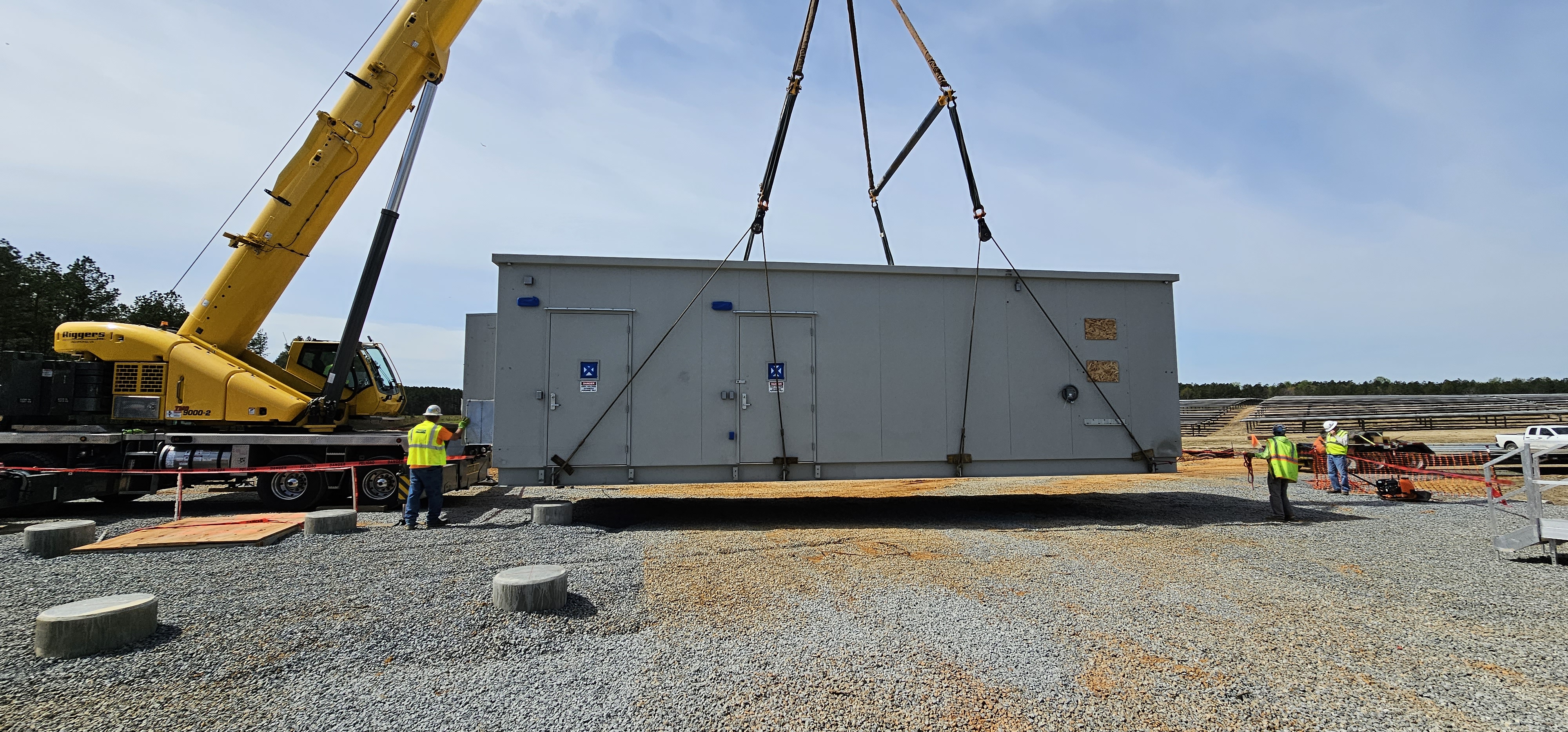 Control building being crane-set at utility-scale solar farm